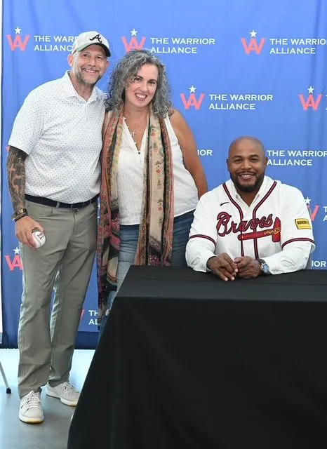 Buffy and Matt Payne with a guest at a Warrior Alliance event