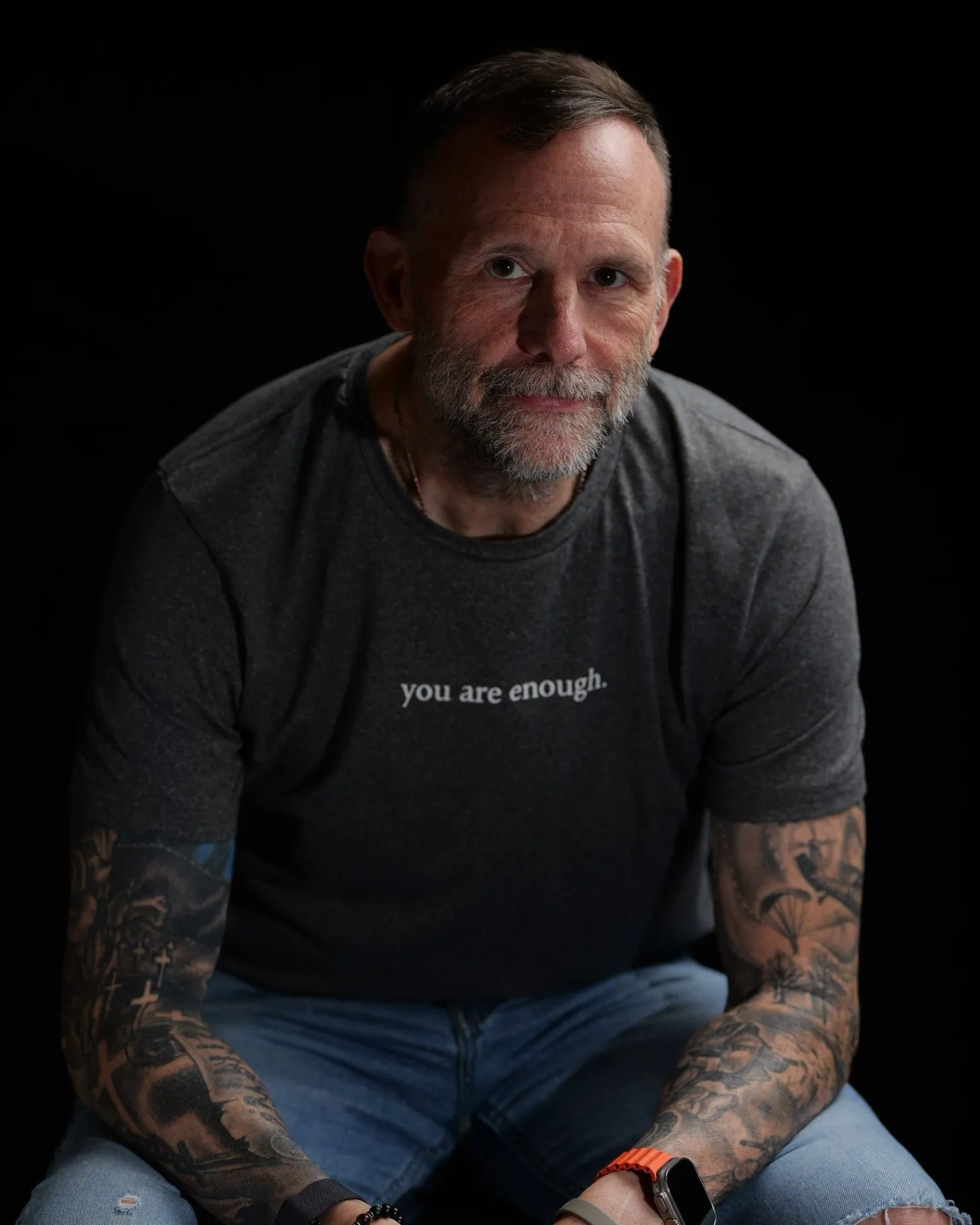 Matt Payne seated for a relaxed professional portrait